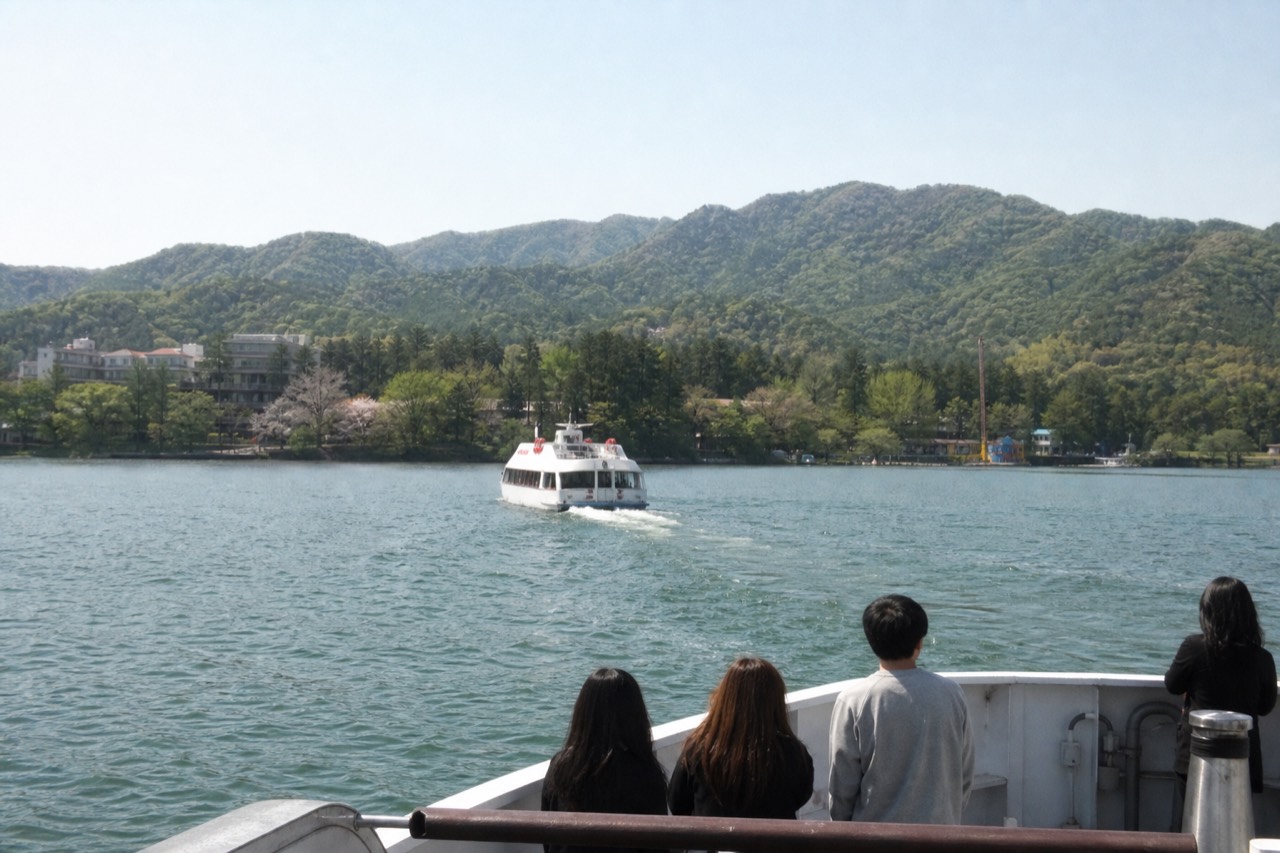 Ferry boat crossing the wide North Han River toward the tree-covered Nami Island, no text, no logos, no people.